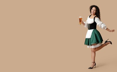 Happy African-American woman holding glass of beer on beige background with space for text. Octoberfest celebration