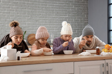 Poster - Ill family eating soup at table in kitchen