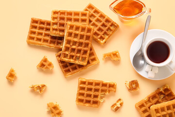 Wall Mural - Tasty Belgian waffles with gravy boat of sweet honey and cup of coffee on yellow background