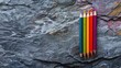 © 2rogan - Colorful pencils on gray stone surface