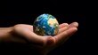 © sarana - Hand Holding a Globe: A hand holding a small globe, representing travel and global connections.