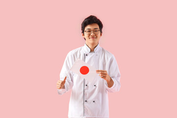 Sticker - Male Asian chef with flag of Japan on pink background