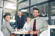 © Hira/peopleimages.com - Happy, business people and team portrait in office meeting for project management and problem solving. Operations workforce, smile and pride for job by government agency for risk assessment or job.