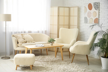 Wall Mural - Cozy sofa, armchairs and coffee table in interior of living room