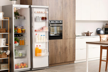 Canvas Print - Fridge full of different fresh products in kitchen