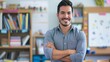 © gn8 - Hispanic Male School Teacher Standing Confidently in Classroom, Education and Teaching Concept