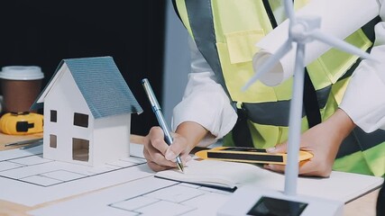 Wall Mural - Architect working on blueprint.engineer inspective in workplace - architectural project, blueprints,ruler,calculator,laptop and divider compass. Construction concept. Engineering tools,