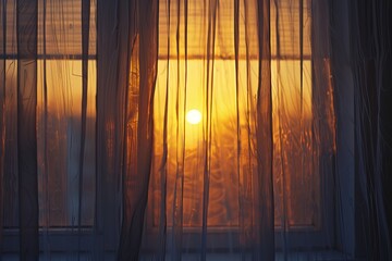 Sunset through the window with curtains on the background of the sun