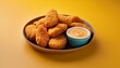 © HeyRix - Spicy fried crispy chicken nuggets on yellow background
