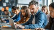 © Munali - A focused teacher engages with students in a modern classroom while using a laptop, promoting a collaborative learning environment in education.