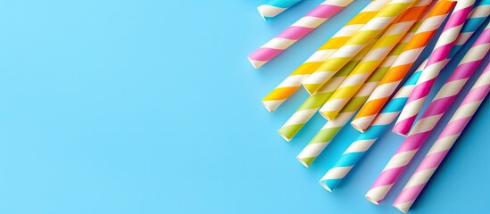 Aufkleber - Colorful paper straws for summer cocktails set against a light blue backdrop featuring ample copy space for your design