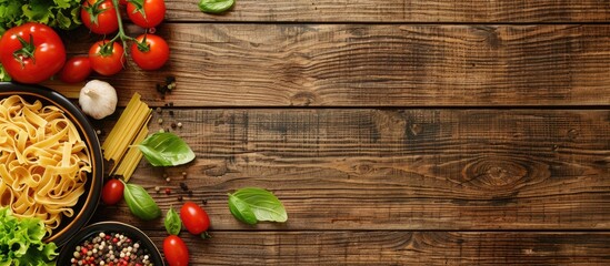 Aufkleber - Cooking essentials like pasta tomatoes salad and spices displayed on a wooden table with a copy space image