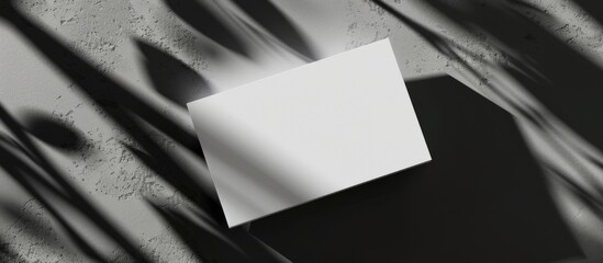 Fototapete - A business card with shadows adding depth to a copy space image