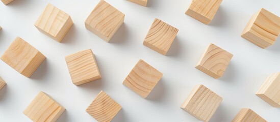 Poster - Flat lay composition with blank wooden cubes on a light background providing copy space image