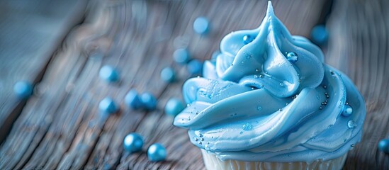 Poster - Close up blue meringue on a wooden backdrop with a macro copy space image