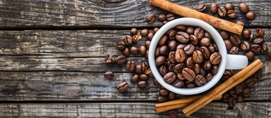 Sticker - Top down view of coffee beans in a white cup with cinnamon sticks placed on a wooden table allowing for copy space image