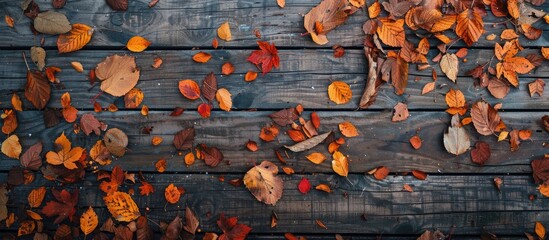 Poster - Aerial view of a wooden surface covered with autumn leaves ideal for a copy space image