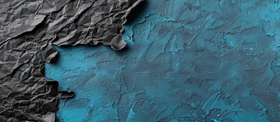 Aufkleber - Black torn paper on a blue concrete surface with copy space image