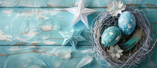 Poster - Celebrate Easter with a vibrant display of Easter eggs in a nest accompanied by a paper star flower and feather on a pastel colored bright blue and white wooden backdrop ideal for a copy space image