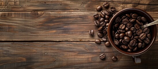 Sticker - Coffee beans placed on a spoon inside a cup on a wooden backdrop with ample copy space image