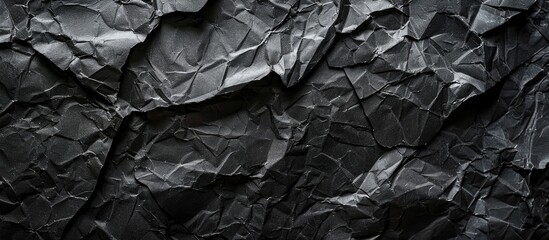 Leinwandbilder - Dark textured paper creating a backdrop for a copy space image