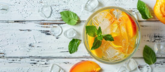 Poster - Top down view of a delightful peach lemonade with sparkling water on a white wooden surface with room for text alongside the image. Creative banner. Copyspace image