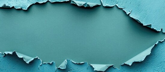 Aufkleber - Blue torn paper set against a green backdrop with room for a copy space image