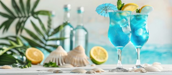 Poster - Blue curacao cocktails creatively displayed in a beach themed bar setting with mint accents on a white table ideal for celebration with a copy space image