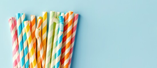 Aufkleber - Colorful paper straws for summer cocktails set against a light blue backdrop featuring ample copy space for your design
