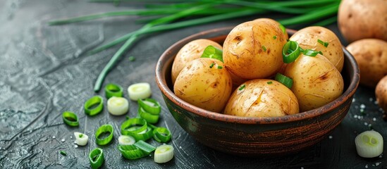 Aufkleber - Delicious baked potato in a bowl with green onion on a bright background suitable as a copy space image