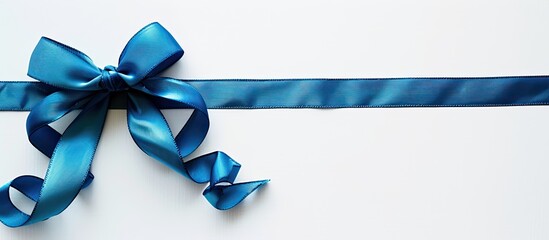 Aufkleber - Blue gift bow and cross ribbon on white background with copy space image