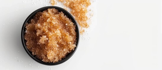 Poster - Top view of a body scrub on a white backdrop offers ample copy space image