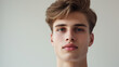 © Mirjana - Young man with minimalistic grooming posing against a white background