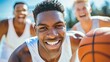 © Viktor - A tight shot of one person holding a basketball, foreground Another person, background, also holds a basketball