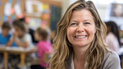 Wall Mural - A smiling teacher in the middle of a classroom, seeing her students in the background and teaching.