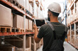 © standret - Holding digital tablet. Foreman is in the storehouse, shipping distribution business