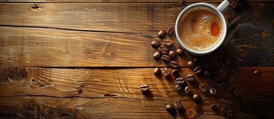 Poster - A cup of coffee with beans on a wooden background is shown in this copy space image which does not include any smoke