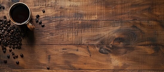 Sticker - Brown wooden table with a coffee cup featuring a coffee bean providing a copy space image