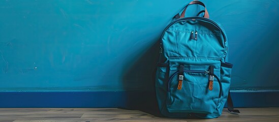 Poster - Blue backpack with ample copy space image for personalization