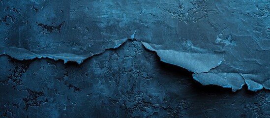 Aufkleber - Black torn paper on a blue concrete surface with copy space image