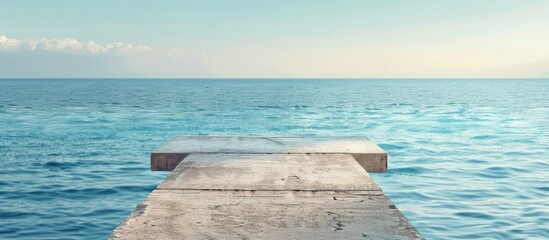 Sticker - Concrete pier offers picturesque view of tranquil sea with copy space image