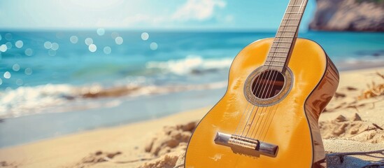 Poster - Blurry yet stunning guitar on sandy beach by the ocean ideal for weekend getaways with copy space image available