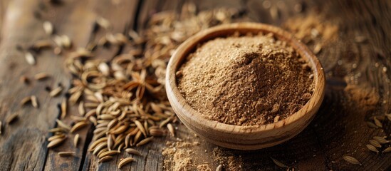 Fototapete - Caraway powder and seeds from Persia displayed on a wooden table with room for text in the image. Creative banner. Copyspace image