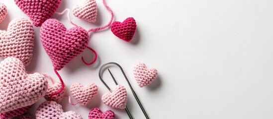 Aufkleber - Top view of amigurumi pink hearts crocheted with a hook on a white backdrop ideal for a Valentine s banner showcasing a copy space image