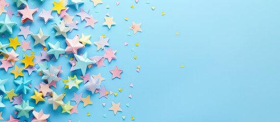 Poster - A vibrant circular arrangement of colorful stars on a pastel blue backdrop ideal for showcasing promotion greetings or enhancing party decor for various celebrations in a copy space image