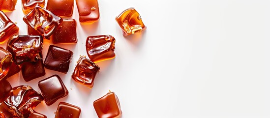 Leinwandbilder - Delicious caramel candy with white background for copy space image