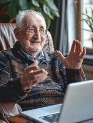 An older adult sitting at home using a computer, suitable for use in lifestyle or technology related projects