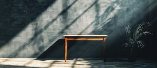 Leinwandbilder - A desk with ample blank space to showcase your product set against a wall casting shadows ideal for a copy space image