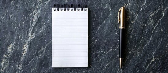 Poster - Display a pen on gray and black textured background with a blank notepad having empty pages for a copy space image