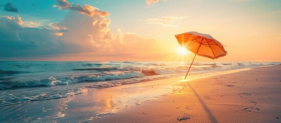 Aufkleber - Beach umbrella providing shade on the sandy shore during sunset with copy space image